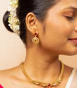 Gold chain necklace with traditional pendant and matching earrings