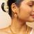 Gold chain necklace with traditional pendant and matching earrings