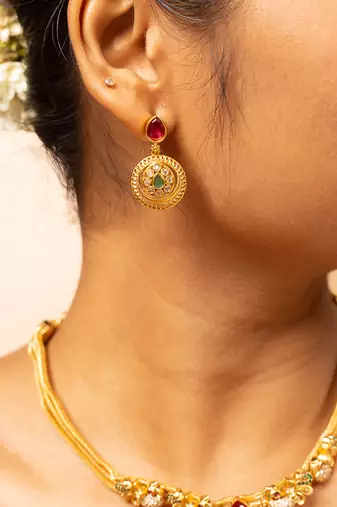 Gold chain necklace with traditional pendant and matching earrings