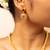 Gold chain necklace with traditional pendant and matching earrings