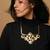 Bold flora high gold collar necklace