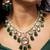Royal gold-toned kundan necklace set with green beads and red detailing