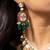 Royal gold-toned kundan necklace set with green beads and red detailing