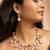 American diamond necklace set with red stone accents