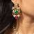 Traditional indian gold necklace set with green and pink gemstones