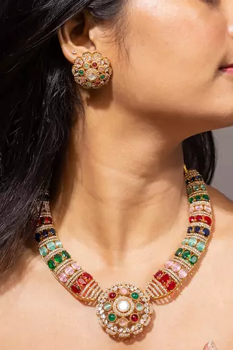 Colorful gold necklace set with multi-colored gemstones
