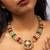 Colorful gold necklace set with multi-colored gemstones
