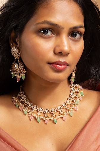 Stunning gold-toned kundan necklace set with pink and green bead drops