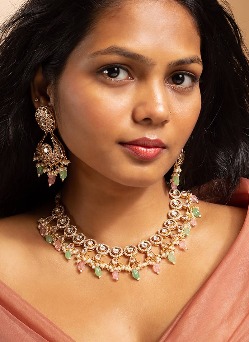 Stunning gold-toned kundan necklace set with pink and green bead drops