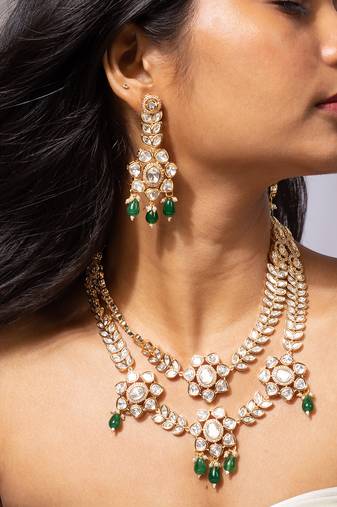Grand kundan necklace set with green bead accents