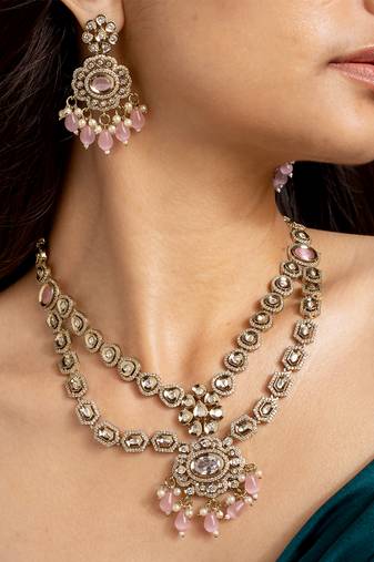 Elegant gold-toned necklace set with pink stones and pearls