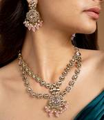 Elegant gold-toned necklace set with pink stones and pearls