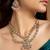 Elegant gold-toned necklace set with pink stones and pearls