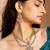 Elegant gold-toned necklace set with pink stones and pearls