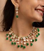Traditional indian kundan necklace and earrings set with green bead accents