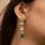 Traditional indian kundan necklace and earrings set with green bead accents
