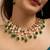 Traditional indian kundan necklace and earrings set with green bead accents