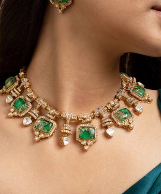 Indian necklace and earrings set with green and clear stone detailing 1