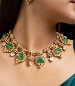 Indian necklace and earrings set with green and clear stone detailing