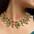 Indian necklace and earrings set with green and clear stone detailing