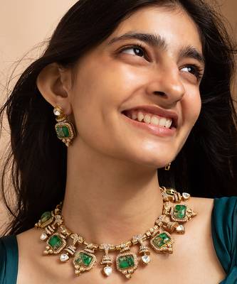 Indian necklace and earrings set with green and clear stone detailing 2