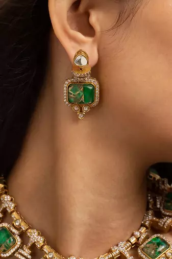 Indian necklace and earrings set with green and clear stone detailing