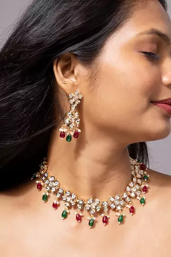 Floral kundan necklace set with ruby and emerald beads