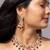 Floral kundan necklace set with ruby and emerald beads