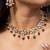Floral kundan necklace set with ruby and emerald beads