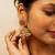 High gold floral jhumka earrings