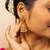 Traditional gold-plated jhumka earrings with pearl detailing