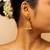 Traditional gold-plated jhumka earrings with pearl detailing