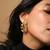 High gold textured hoop earrings with crystal accent
