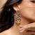 Two tone leaf and bird motif statement earrings