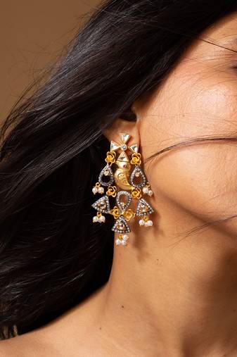 Two tone bird and pearl drop statement earrings