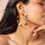 Two-tone pearl hoop earrings with floral accents