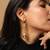 Elegant high gold textured drop earrings