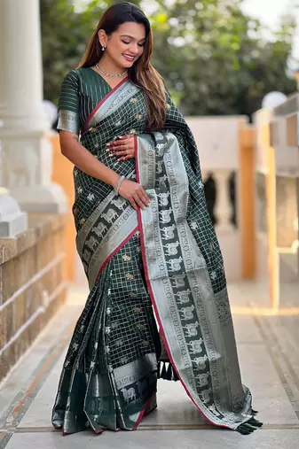 Green self design embellished silk blend saree with blouse