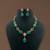 Regal emerald & ruby stone necklace set with floral accents by treemoda