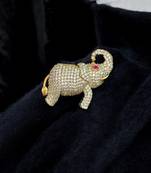 Gold-toned crystal elephant brooch with ruby eye accent