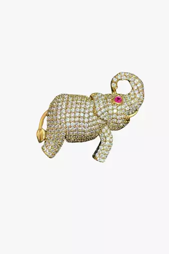 Gold-toned crystal elephant brooch with ruby eye accent