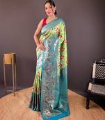 Green self design embellished silk blend saree  with blouse  