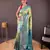 Green self design embellished silk blend saree  with blouse  