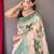 Green embellished self design silk blend saree with blouse