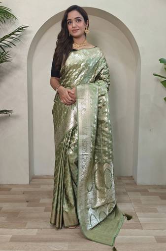 Green embellished self design silk blend saree with blouse  