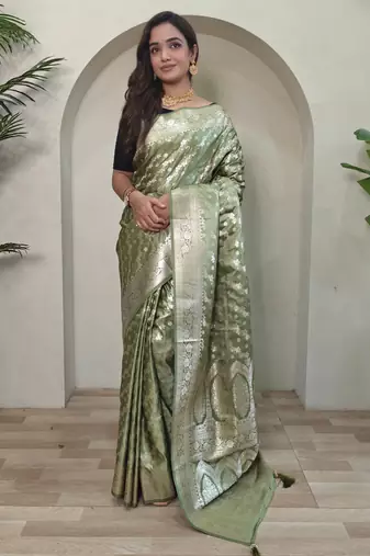 Green embellished self design silk blend saree with blouse  