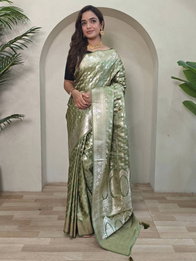 Green embellished self design silk blend saree with blouse  