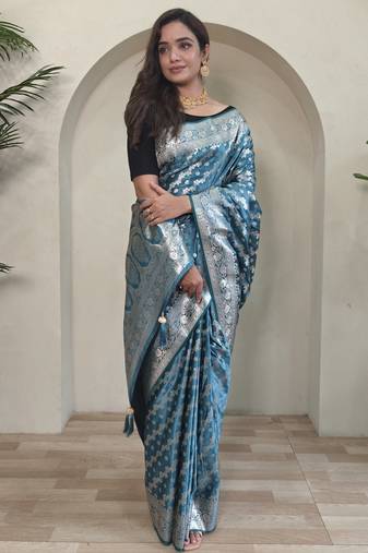 Green embellished self design silk blend saree with blouse  