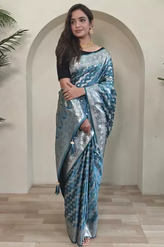 Green embellished self design silk blend saree with blouse  