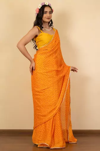 Women's bright orange chevron print golden lace border chiffon saree with unstiched blouse piece